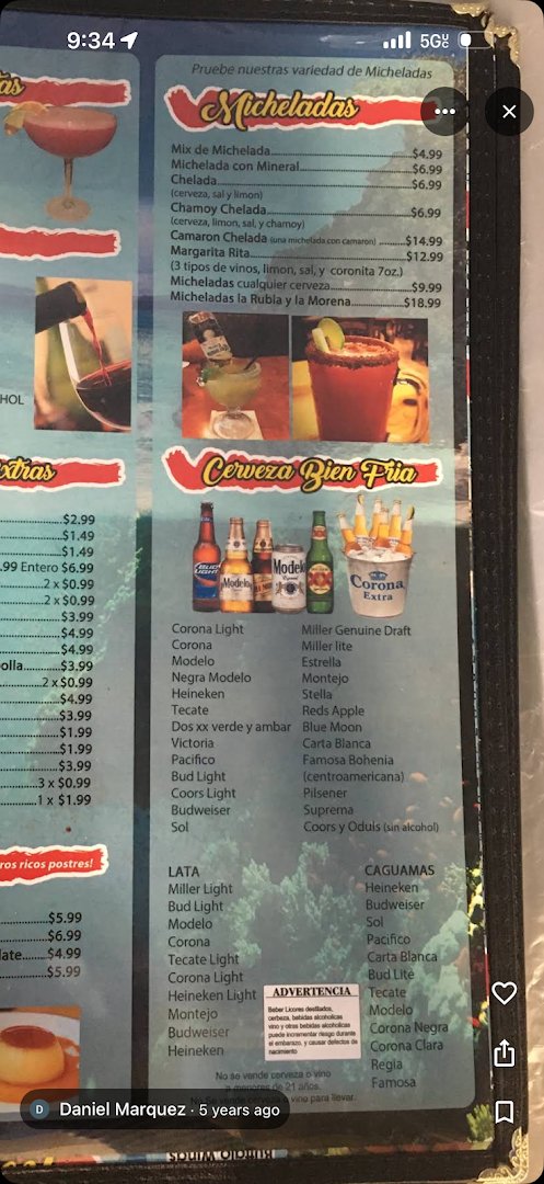 Shared table with seafood and cocktails.