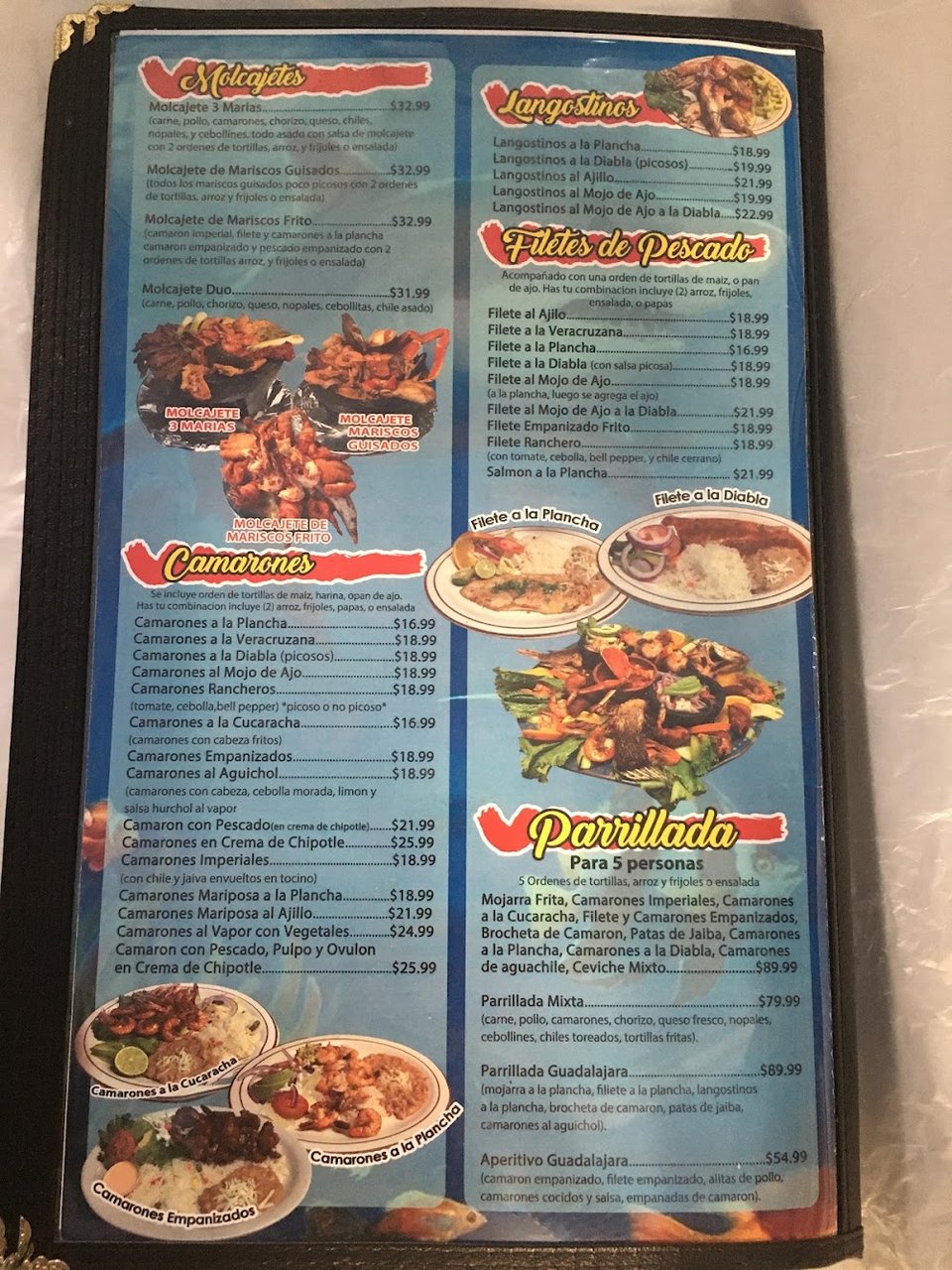 Restaurant menu with juices, desserts, and seafood.